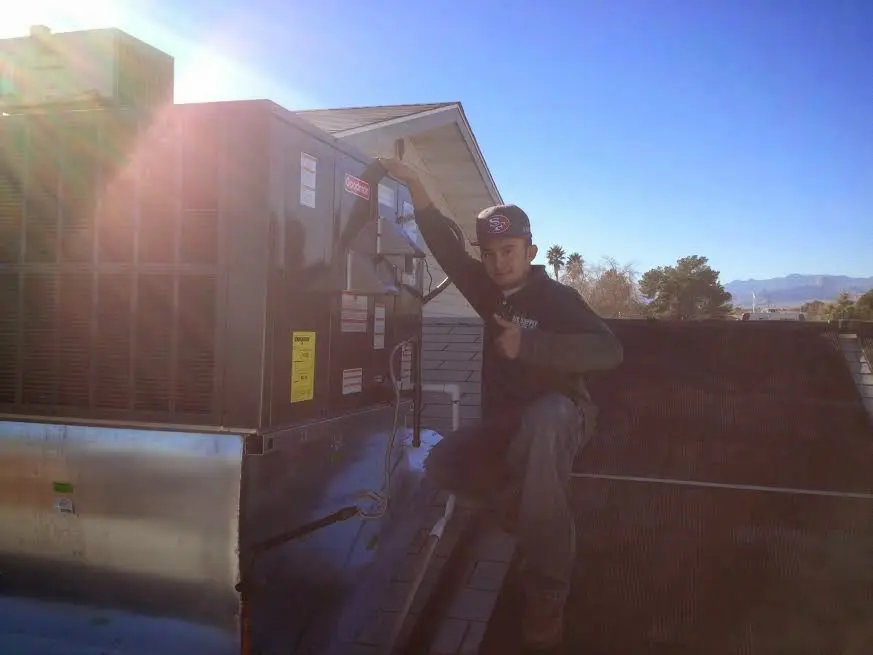 HVAC technician performing HVAC Inspection on a rooftop unit in Towamencin